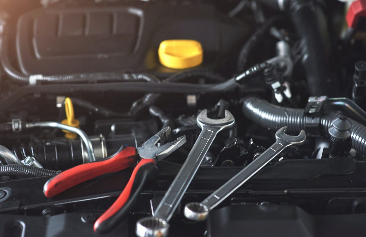 mechanic checking a transmission